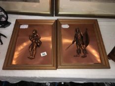 A pair of copper African wall plaques