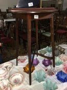 A small Edwardian inlaid mahogany circular table