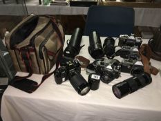 A quantity of 35mm cameras with lenses including Pentax and Practica