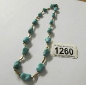 A retro turquoise stone necklace set in 14ct gold with 9ct gold clasp