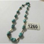 A retro turquoise stone necklace set in 14ct gold with 9ct gold clasp