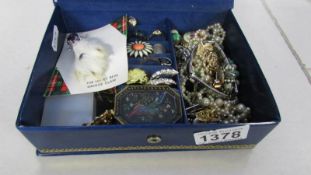 A box of vintage costume jewellery