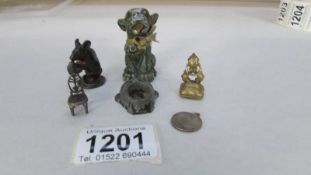 A watch fob and assorted small decorative metal items