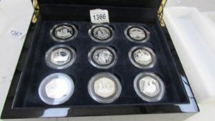 A cased set of 18 silver 50p pieces,