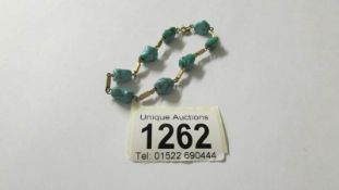 A retro turquoise stone bracelet set in 14ct gold with 9ct gold clasp