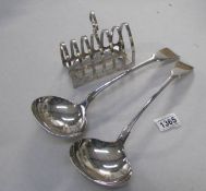 A pair of silver plated ladles and a silver plated toast rack