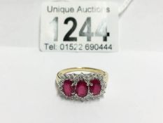 An 18ct yellow gold ring set ruby and diamonds,