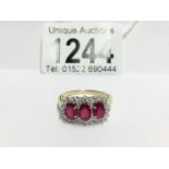 An 18ct yellow gold ring set ruby and diamonds,