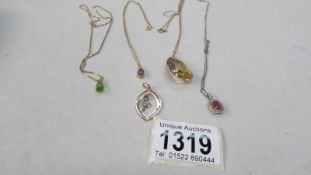5 gold pendants with various stones including ruby and diamond set white gold pendant