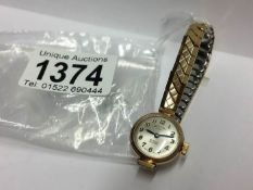 A Rotary 21 jewel ladies wrist watch on a rolled gold bracelet