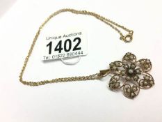 An Edwardian 9ct gold seed pearl pendant