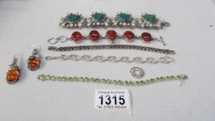 6 items of silver jewellery including bracelet with Mexican face depictions,