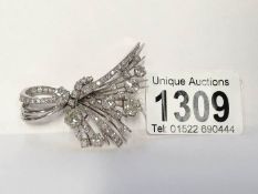 A superb diamond brooch in the form of a corsage