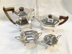 A 4 piece silver tea set comprising teapot, hot water jug, milk jug and sugar bowl, marked EV,