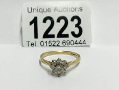 An 18ct yellow gold floral ring of approximately 60pts of diamonds,