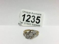 A yellow gold floral diamond crossover ring,