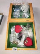 A wooden box of costume jewellery