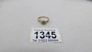 A 9ct gold and green stone dress ring,