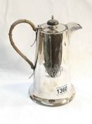 A silver chocolate pot marked W & H, Sheffield 1922,