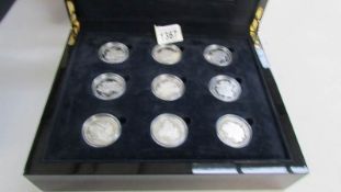 A cased set of 18 silver crowns,