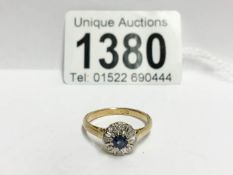 A diamond and sapphire cluster ring in 18ct gold dated Birmingham 1965,