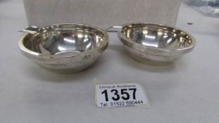 A pair of silver ash trays marked The Goldsmiths and Silversmiths Company, London hall mark,