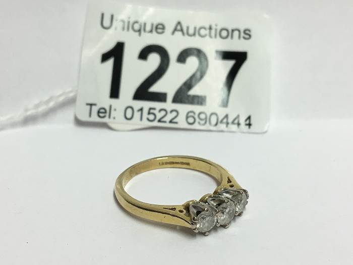 A 3 stone yellow gold half carat diamond ring, - Image 2 of 3