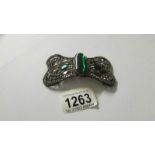 A Victorian cut steel buckle set with 3 green stones