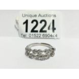 An 18ct white gold 2 bar ring of spaced diamonds