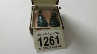 A pair of vintage green stone set silver pendant earrings