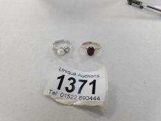 A 9ct gold ring set amethyst and a white gold ring set pearl