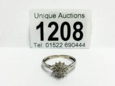 A 9ct white gold diamond cluster ring,