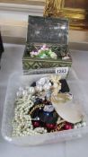 A box and a tin of assorted costume jewellery