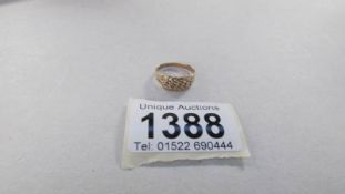 A plaited gold ring in 9ct gold dated Birmingham 1902,