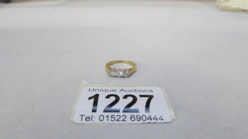A 3 stone yellow gold half carat diamond ring, - Image 3 of 3