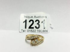 An 18ct gold 61pt diamond crossover ring,