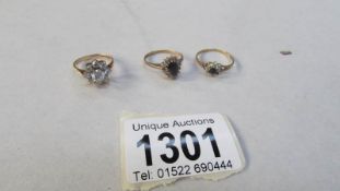 3 9ct gold dress rings (one missing a stone)