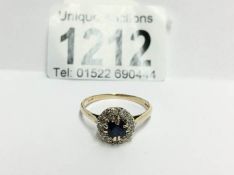 An 18ct gold diamond and sapphire ring,