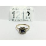 An 18ct gold diamond and sapphire ring,