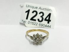 An 18ct gold floral 55pr diamond ring,