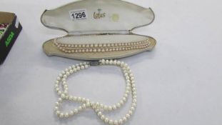 2 double strand pearl necklaces with silver clasps
