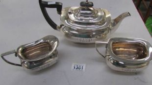 A silver 3 piece tea set comprising teapot, milk jug and sugar bowl, marked W & H, Sheffield 1923,