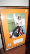 A framed and glazed autographed photo of Honor Blackman