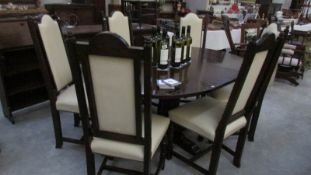 A dark wood Jaycee dining table and 6 chairs