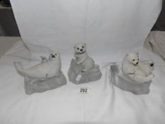 A Franklin Mint bisque porcelain seal pup,