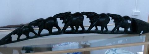 A carved elephant troup