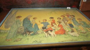 A framed religious scene by Margaret W Tarrant