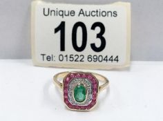 A yellow gold Suffragette style emerald,