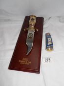 The official General Robert E Lee Bowie knife on wooden back and a Napoleon theme penknife