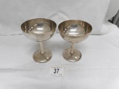 A pair of silver goblets